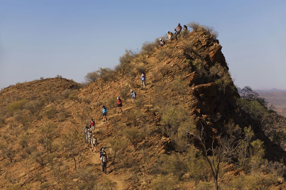 Hike over high ridgelines in the hills along the Larapinta Trail in the Northern Territory.