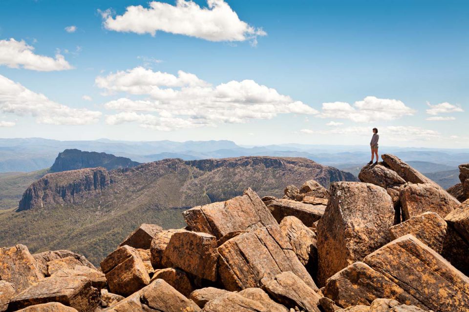 Hike to the top for amazing views on the Cradle Mountain Huts Walk in Tasmania.