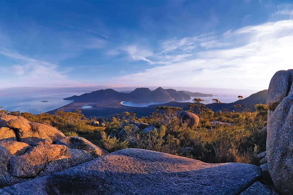 Take in magnificent views of Wineglass Bay and Hazard Mountains in Tasmania.