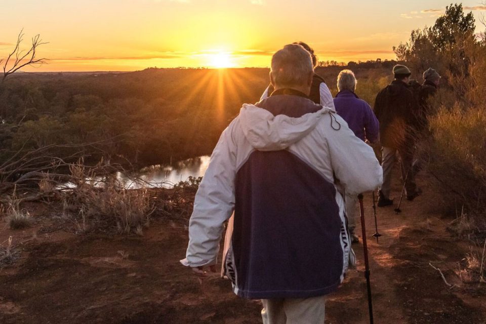 Walk as the sun rises to Headings Cliff on the Murray River Walk in South Australia.