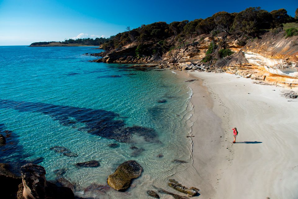 Walk along pristine, white sand beaches on the Maria Island Walk in Tasmania.