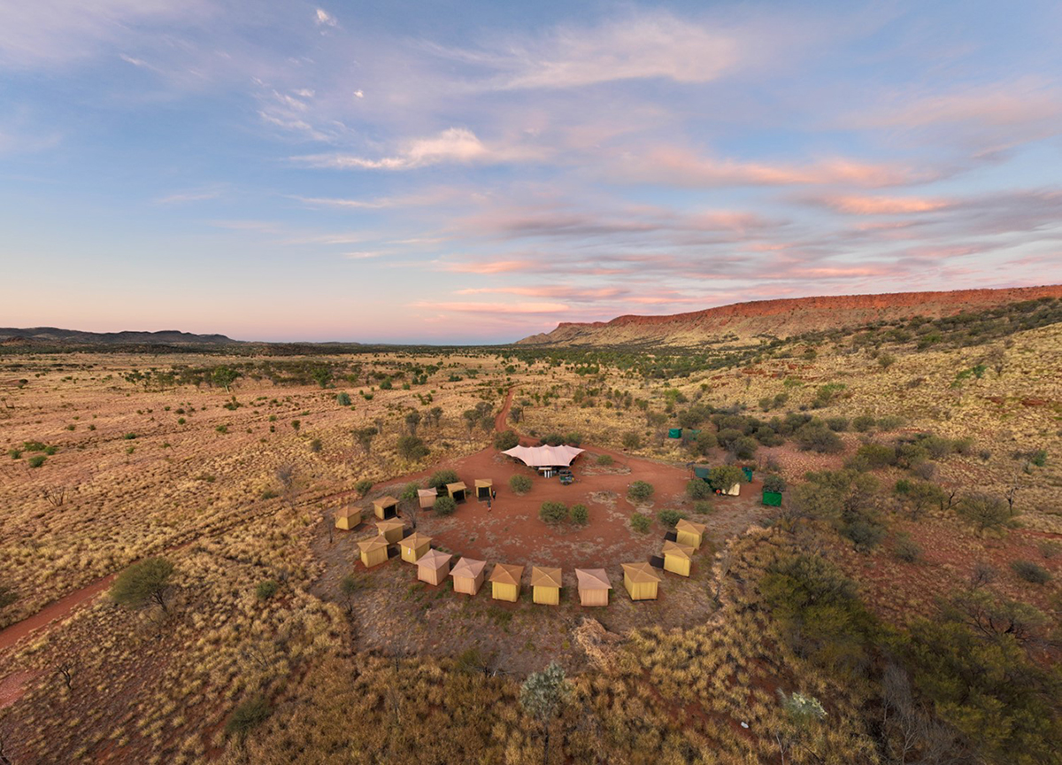 You don’t realise how much it’s needed… until you’re immersed in it.  You might think you know what to expect… and have even prepared. Yet nothing quite prepares you for the enormity of the outback.

It’s humbling.

We all know it’s vast… yet when you’re in it, you feel it.

The scale. The stillness. The space.

The deep red of the sand.
The green plants, trees, shrubs - all so much brighter after the recent rains.
Wildflowers, colourful and scattered across the landscape.
Birdlife surprising us… and a bit of fun as we angled for the best shot.

The anticipation of walking from Kata Tjuṯa towards Uluṟu awe-inspiring. 

This exclusive multi-day stay inside the Uluṟu–Kata Tjuṯa National Park.
Grounding. Invigorating. Transformative.

There was comfort in the tents, and star-lit night skies.
There was laughter, long chats, and those easy silences that don’t need filling.

A refreshing foot spa to cool weary feet, accompanied by an icy G&T.

The private lodge… breathtaking, sitting quietly in the landscape, with views across both Uluṟu and Kata Tjuṯa.

And the food… delicious lunch boxes that surprised and delighted.
The barramundi red curry took out “best ever” according to fellow walker Karen.

Drawn to sunrise for the peace and contemplation…
only a few short steps to the top of a sand dune.

What stays with you most is the listening.

To the land.
To the stories.
To each other.
And to yourself.

A key learning from Aṉangu.
Listen first. 
Palya (hello, thank you, all good).

There’s a moment where you walk alone for a stretch.
No conversation. Just footsteps and breath.

Peace. Joy. Gratitude.

Footsore. A sense of achievement.
And quietly, a commitment to more walking.

Because in doing it, in being in it, out there, you’re reminded how good it feels.

Strong. Capable. Ready for what’s next.

📸Uluṟu–Kata Tjuṯa Signature Walk now open. Experience the Uluru Kakararra Trail 54 Km 4 nights / 5 days with Tasmanian Walking Company.

Comment below for more information.

#GreatWalksOfAustralia #UluruKataTjutaSignatureWalk #WalkingAustralia #OutbackAustralia #MultiDayWalks