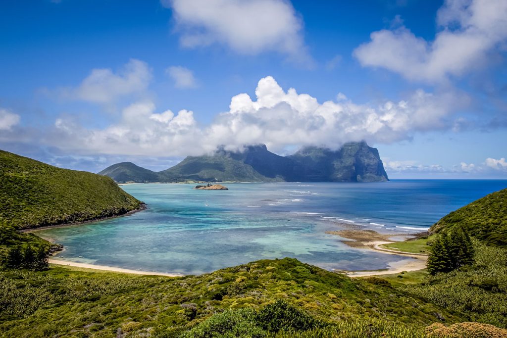 Lord Howe Island lagoon with Mount Gower and Mount Lidgbird rising above turquoise waters and lush green hills